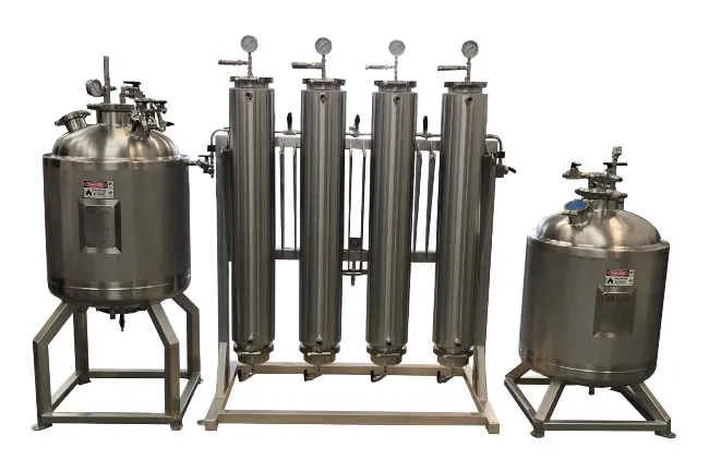 A silver metal machine with different compartments and chambers that are all connected