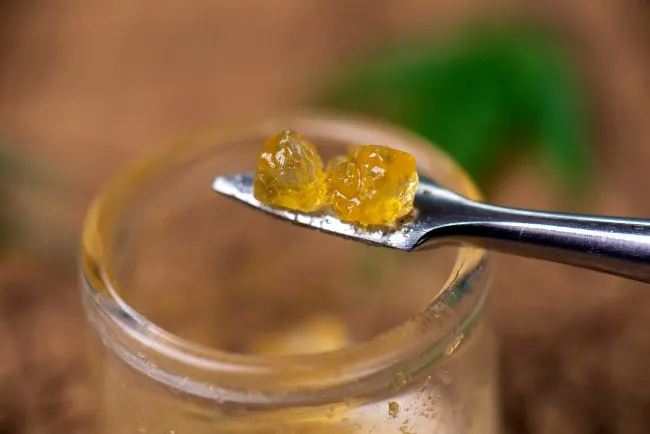 orange-ish concentrates on a silver dab tool